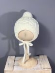 Детская вязаная шапочка на завязках с помпоном GulSara